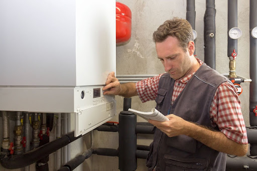 homeowner looking at manual to see what he can do to fix boiler on his own